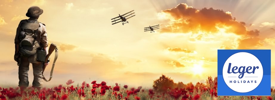 image of an World War 1 soldier looking into the distance of the battlefield with two tri-planes flying into the sunset